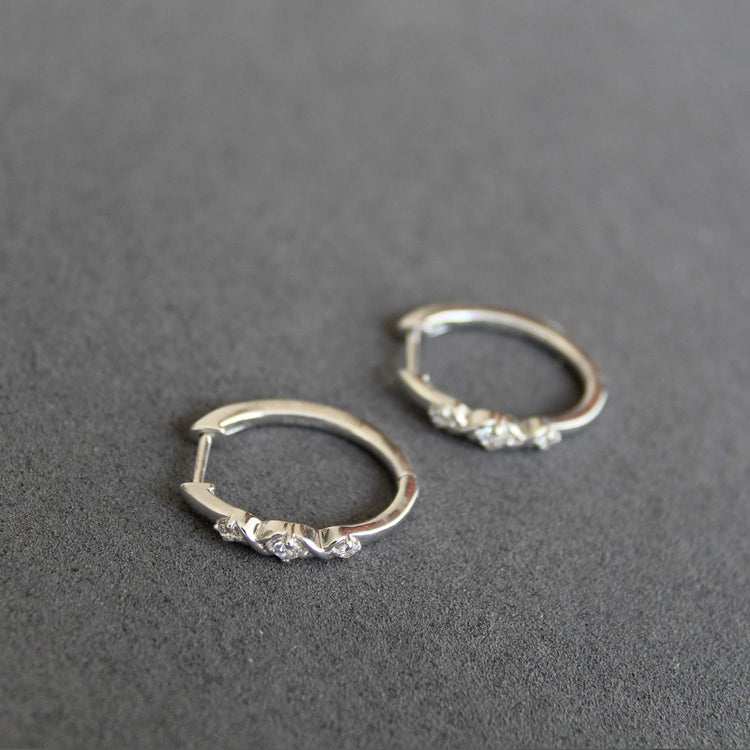 1/4 Cttw Diamond Infinity Oval Hoop Earrings set in 925 Sterling Silver