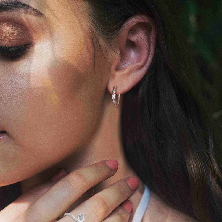 1/4 Cttw Diamond Infinity Oval Hoop Earrings set in 925 Sterling Silver