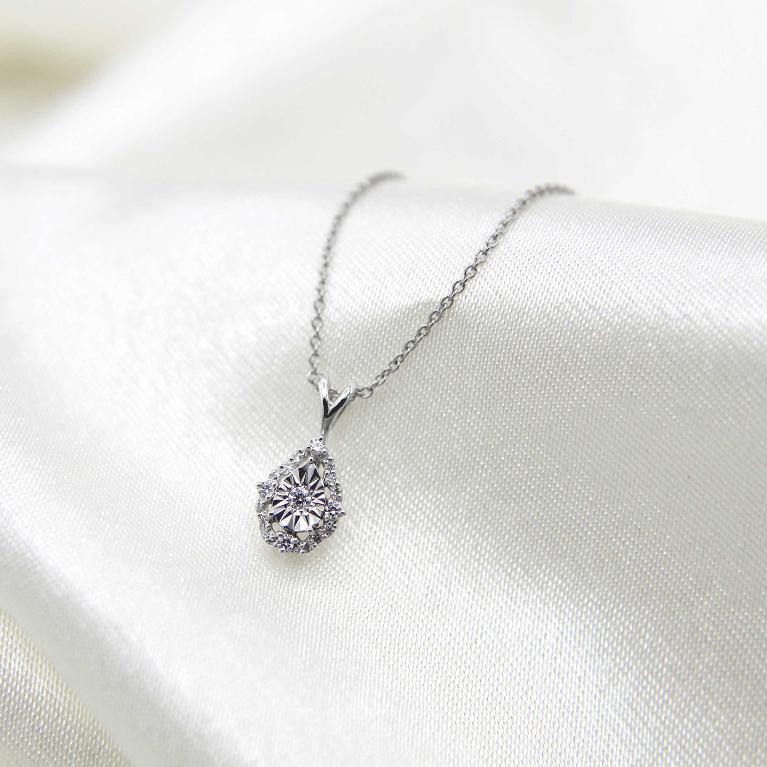 1/10CT TW Diamond Teardrop Pear Cluster Fashion Pendant in Sterling Silver
