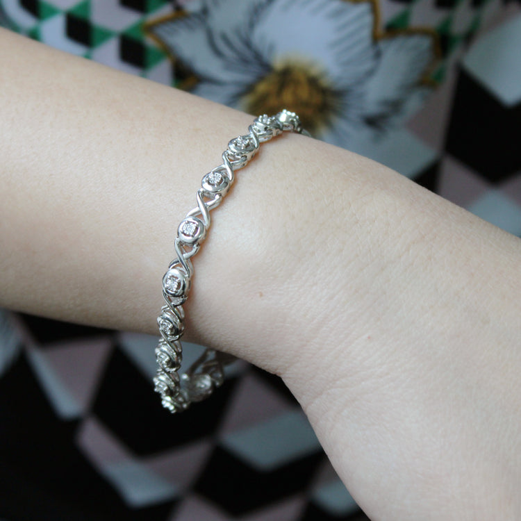 1/6ct tw Diamond XO Round Tennis Bracelet in Sterling Silver