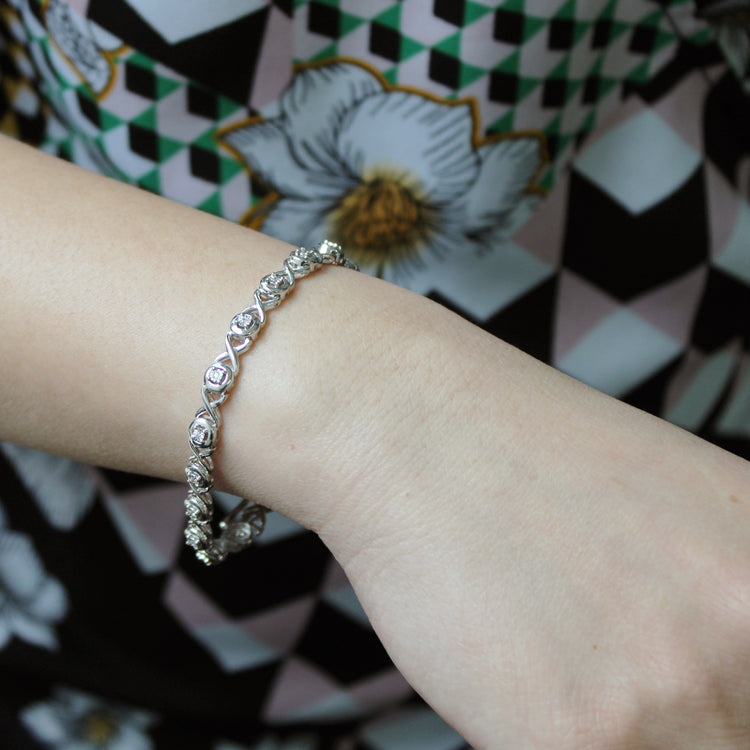 1/6ct tw Diamond XO Round Tennis Bracelet in Sterling Silver