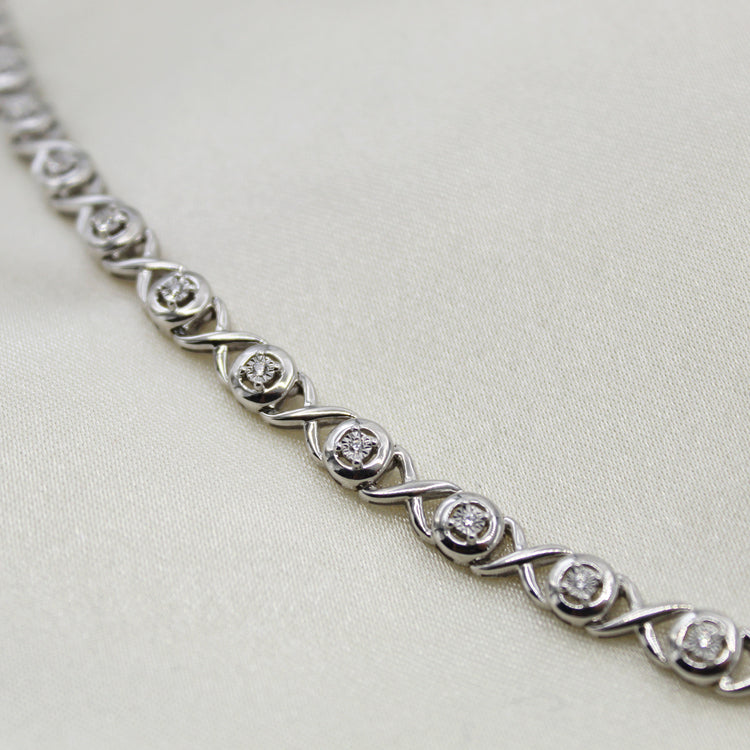 1/6ct tw Diamond XO Round Tennis Bracelet in Sterling Silver