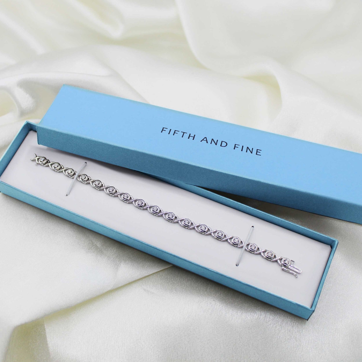 1/6ct tw Diamond XO Round Tennis Bracelet in Sterling Silver