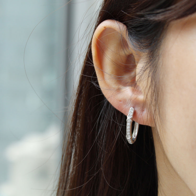 1/2 Cttw Diamond XO Hoop Earrings set in 925 Sterling Silver