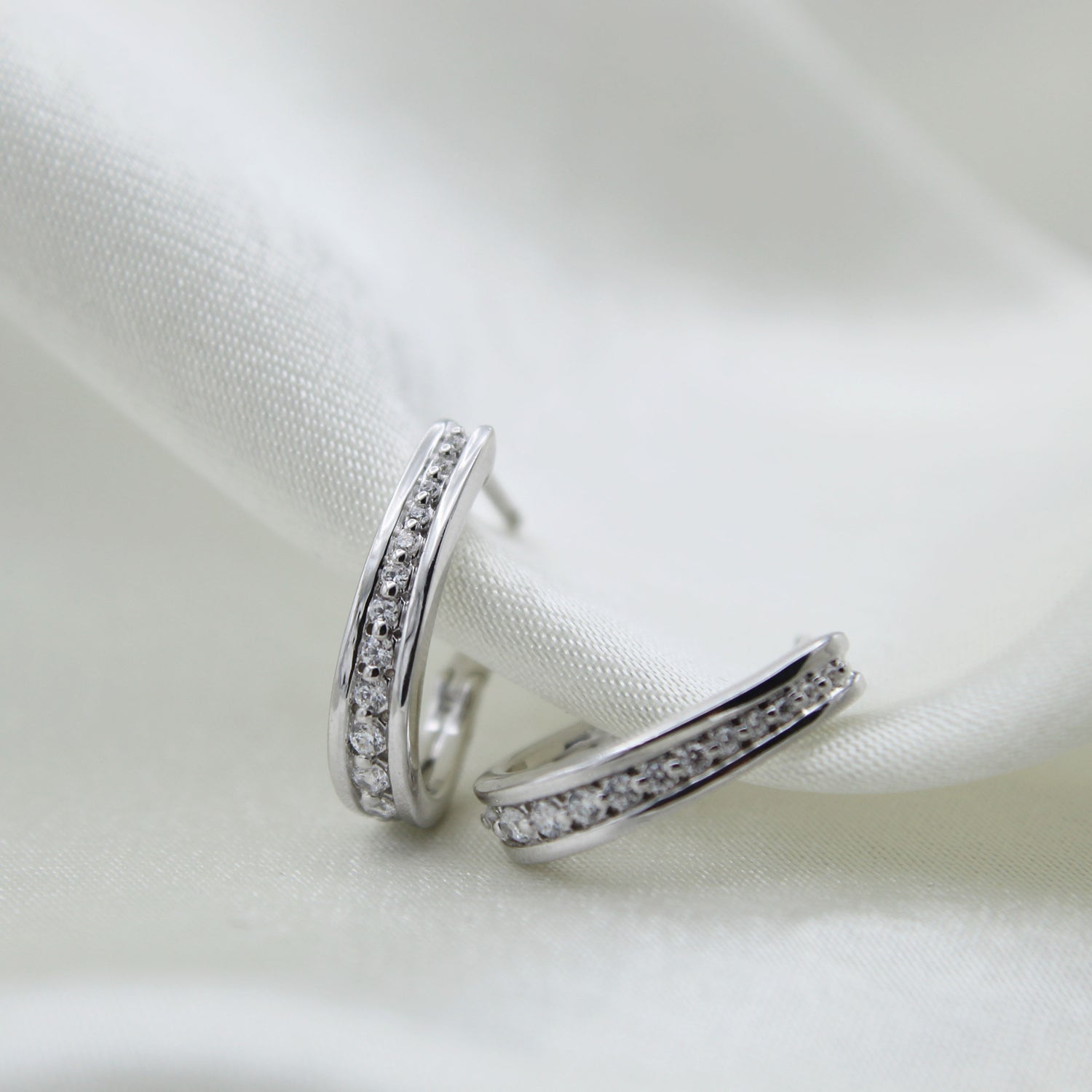 1/4 Cttw Diamond Channel-Set Horse Shore Hoop Earrings set in 925 Sterling Silver