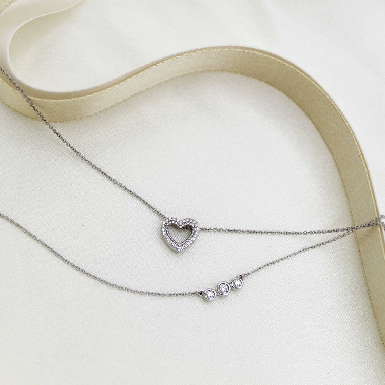 Heart and Three Stone Layered 1/10 Cttw Natural Diamond Pendant Necklace set in 925 Sterling Silver…