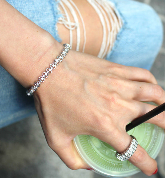 1/8ct tw Diamond Infinity Heart Tennis Bracelet in Sterling Silver