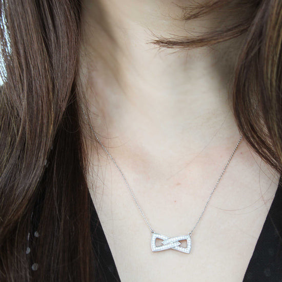 1/4 Cttw Diamond Double Link Infinity Bow Pendant Necklace set in 925 Sterling Silver