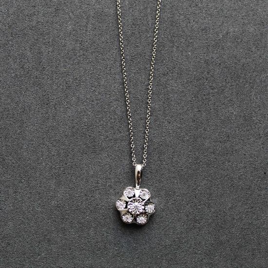 1/8CT TW Diamond Floral Cluster Fashion Pendant in Sterling Silver