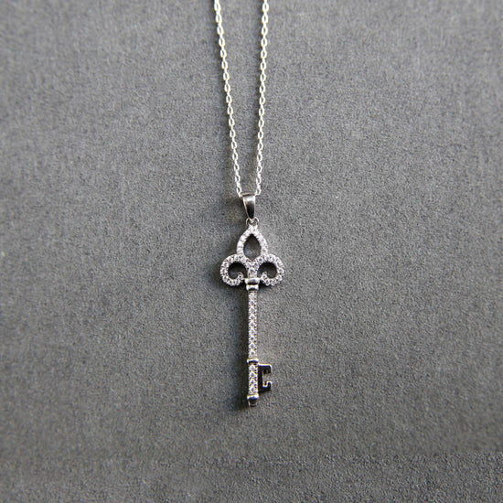 1/5 Cttw Diamond Key Enchanted Pendant Necklace set in 925 Sterling Silver