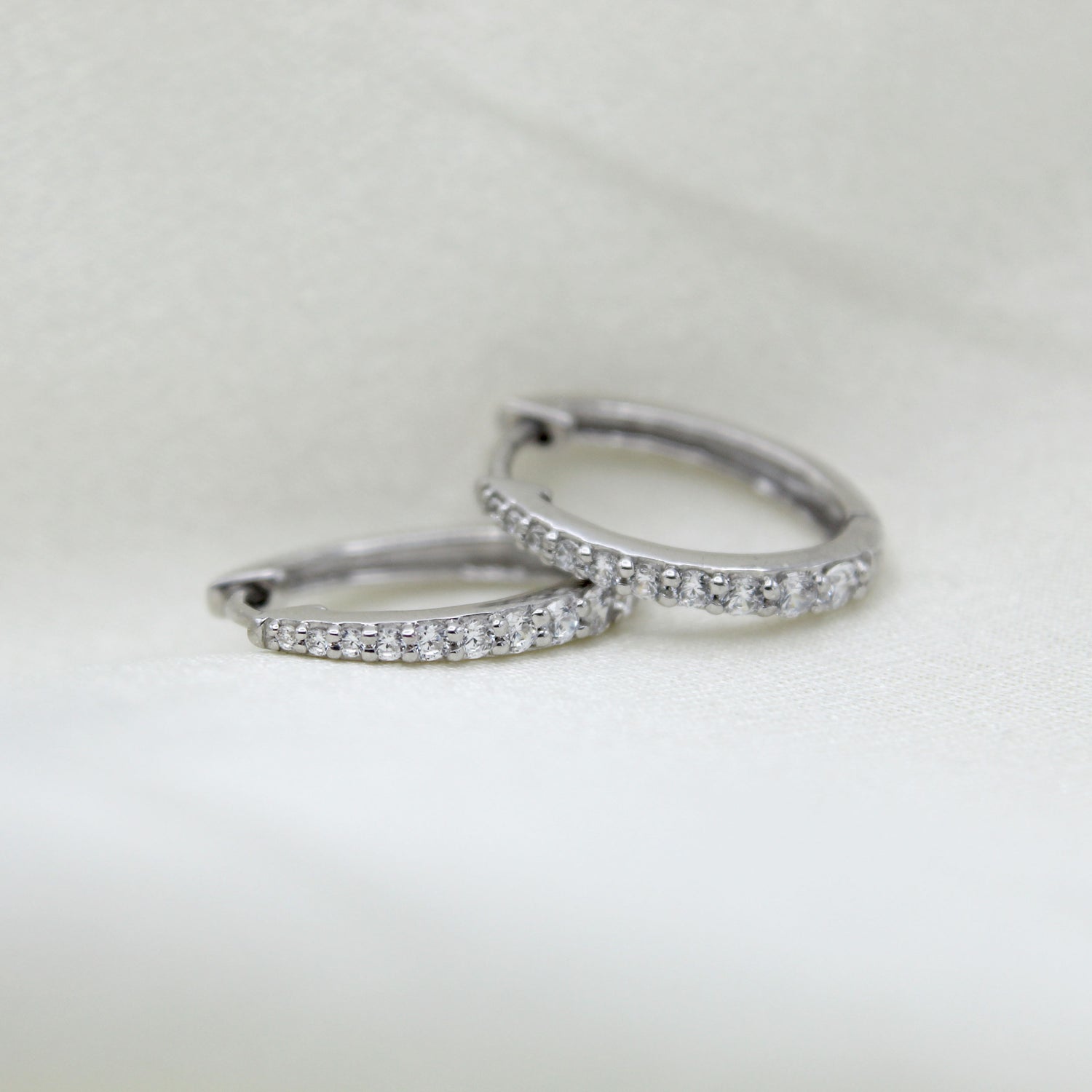 1/2 Cttw Diamond Oval Hoop Earrings set in 925 Sterling Silver