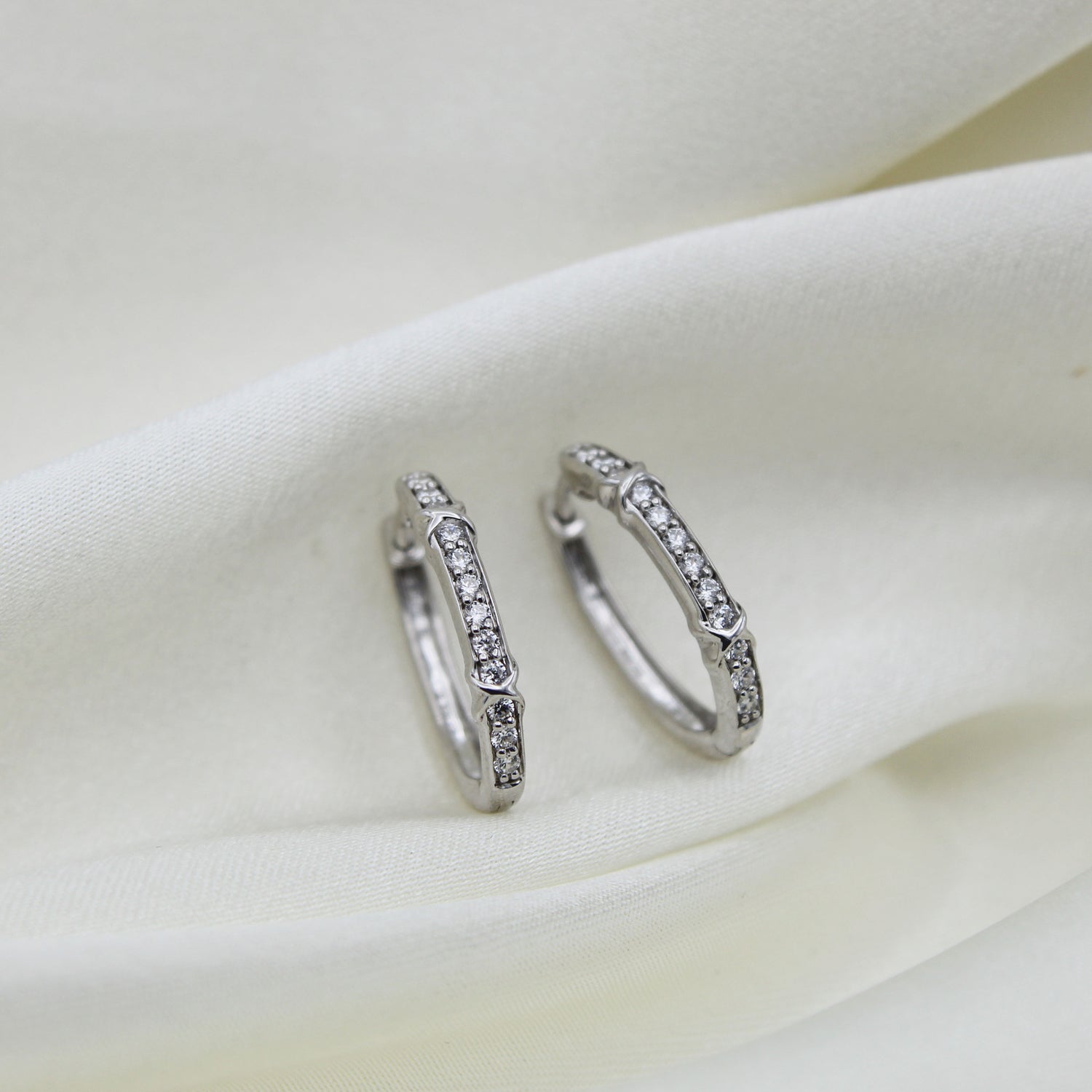 1/2 Cttw Diamond XO Hoop Earrings set in 925 Sterling Silver