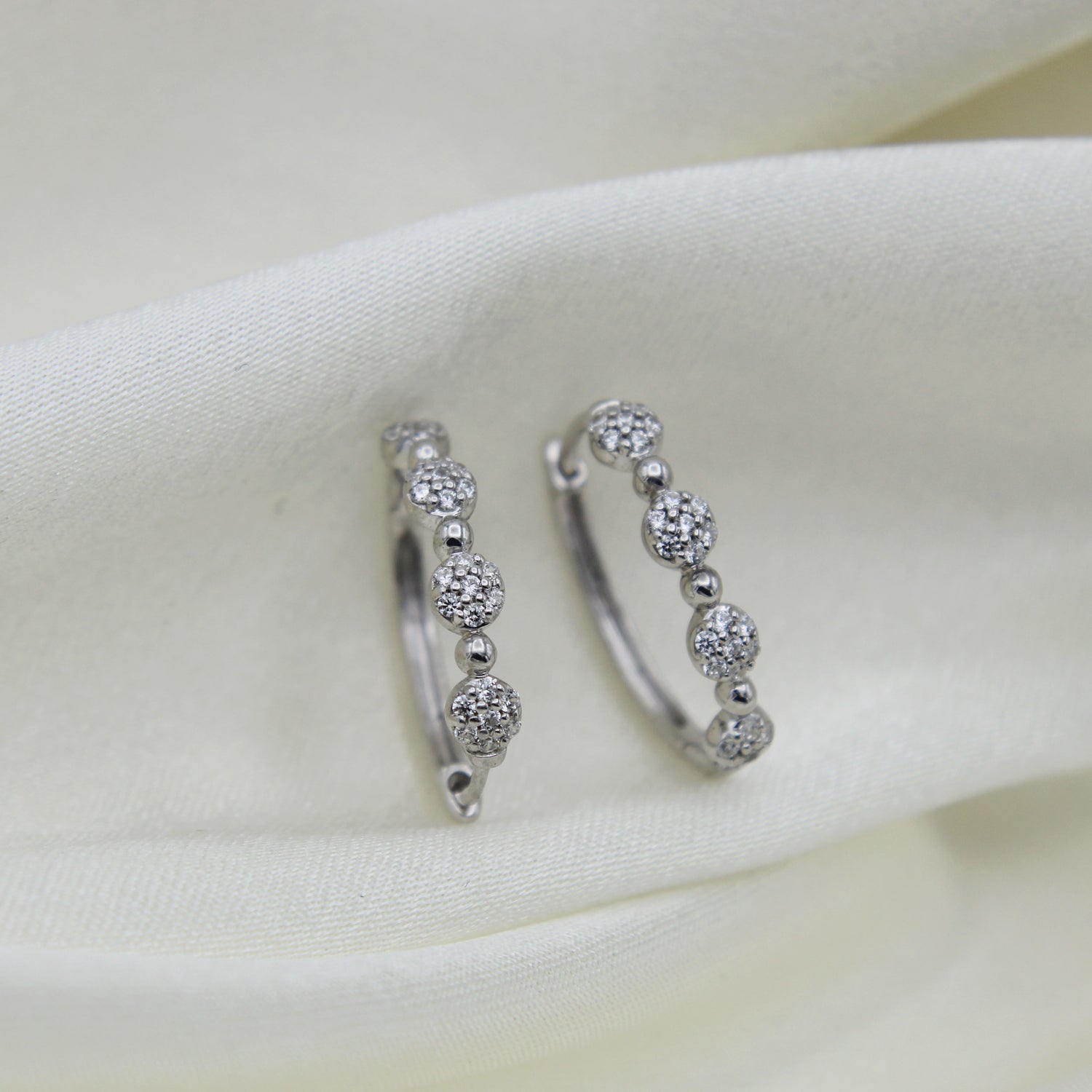 1/2 Cttw Diamond Four Cluster Hoop Earrings set in 925 Sterling Silver